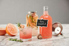 Load image into Gallery viewer, Craft Connections Co Spirit Infusion Kit cocktail kit includes everything you need to make some delicious grapefruit rosemary infused vodka. Serve your infused booze with this classic 750 ml liquor bottle with wood cork top and chalk board hang tag.
